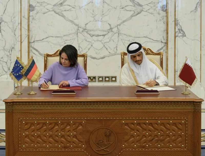 HE Sheikh Mohamed bin Abdulrahman al-Thani signing the MoU with Annalena Baerbock on Wendesday.