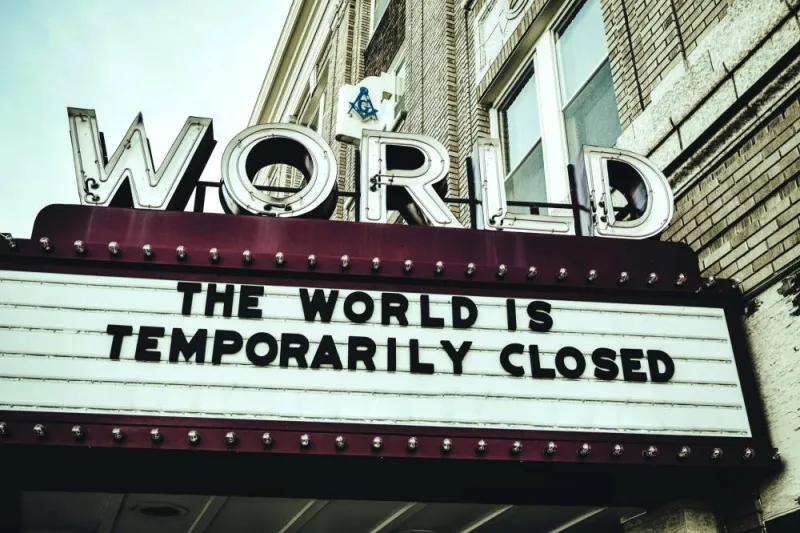 REMINDER: A reflective image of a closed cinema in the United States at the peak of the pandemic.