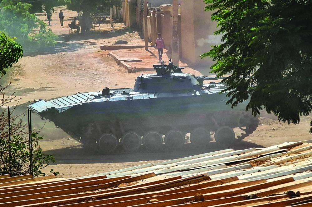 
A Sudanese army armoured vehicle is stationed in southern Khartoum, yesterday, amid ongoing fighting between two rival generals. 