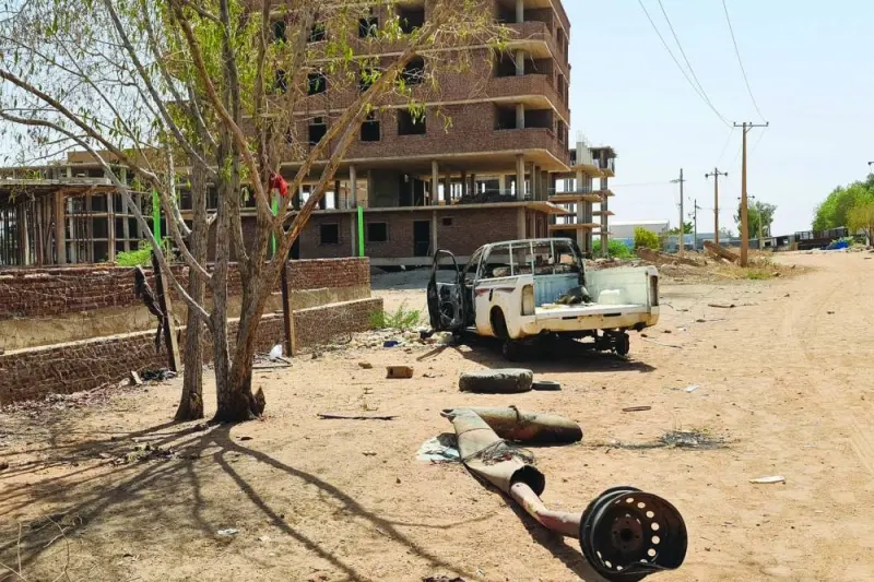 A damaged and looted pick-up truck remains on the roadside in Khartoum, on Tuesday, after a one-week ceasefire between Sudan’s army and paramilitary Rapid Support Forces officially went into force.