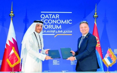 HE the Minister of Communications and Information Technology Mohamed bin Ali al-Mannai and Serbian Minister of Information and Telecommunications Mihailo Jovanovic exchanging the signed agreements on the sidelines of the Qatar Economic Forum, Powered by Bloomberg.