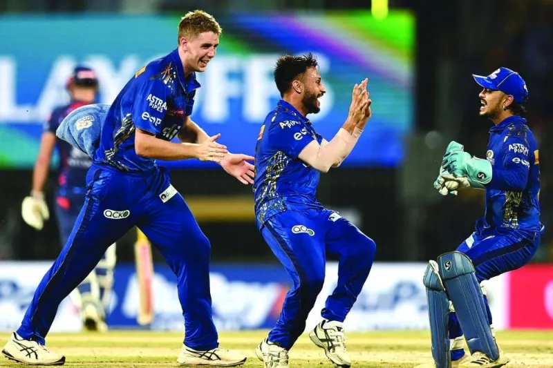 Mumbai Indians’ Akash Madhwal (centre) celebrates with teammates after the dismissal of Lucknow Super Giants’ Nicholas Pooran (not pictured) during the IPL eliminator match at the M A Chidambaram Stadium in Chennai on Wednesday. (AFP)