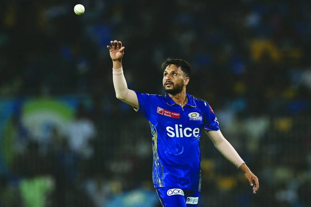 Mumbai Indians&#039; Akash Madhwal prepares to catch a ball during the Indian Premier League (IPL) Twenty20 eliminator cricket match between Lucknow Super Giants and Mumbai Indians at the MA Chidambaram Stadium in Chennai on May 24, 2023. (AFP)