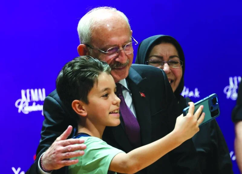
Kilicdaroglu poses for a selfie with a boy during an indoor campaign event in Ankara yesterday, ahead of today’s presidential runoff vote. 