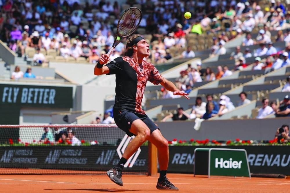 Greece’s Stefanos Tsitsipas plays a forehand return to Czech Republic’s Jiri Vesely during their match on day one of the French Open at Roland Garros on Court Philippe Chatrier in Paris on Sunday. (AFP)