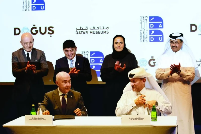 HE Sheikha Al-Mayassa bint Hamad bin Khalifa al-Thani, along with other dignitaries, at the signing ceremony.