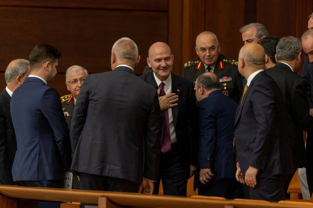 Turkish Interior Minister Suleyman Soylu greets ministers and army generals as he arrives to the swearing-in ceremony of President Tayyip Erdogan after his election win at the Turkish Parliament in Ankara. REUTERS/Umit Bektas