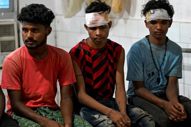 Wounded survivors rescued from a carriage wreckage of a three-train collision near Balasore, sit at the Soro government hospital in India&#039;s eastern state of Odish. Punit PARANJPE / AFP