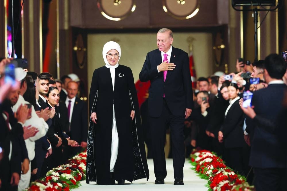 Turkish President Tayyip Erdogan and his wife Emine Erdogan greet guests during his oath-taking ceremony at the Presidential Complex in Ankara on Saturday. (AFP)