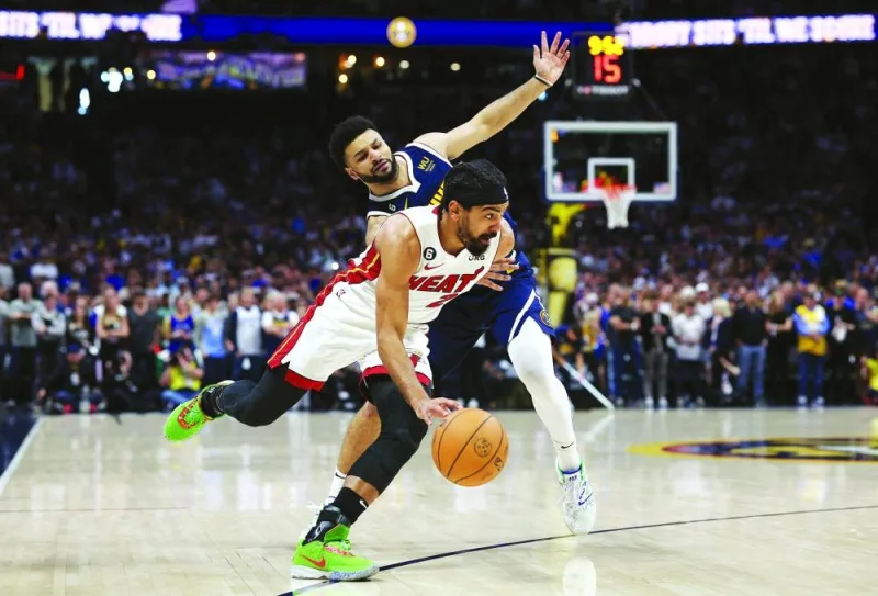 
Gabe Vincent of the Miami Heat dribbles against Jamal Murray of the Denver Nuggets during the first quarter in Game Two of the 2023 NBA Finals at Ball Arena in Denver. (AFP) 