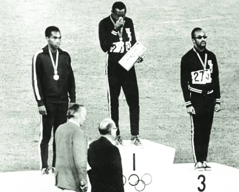 
Jim Hines of the USA (centre), Lennox Miller of Jamaica (left) and Charles Greene of the USA stand on the podium on October 14, 1968 after receiving their medals for the men’s 100m event at the Mexico Olympic Games. Hines equalled the world record of 9.9 seconds to take the gold. (AFP) 