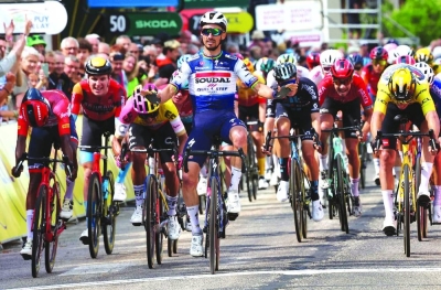 Soudal Quick-Step’s French rider Julian Alaphilippe (centre) crosses the finish line to win the second stage of the 75th Criterium du 
Dauphine cycling race after covering a distance of 167,3 kms betwenn Brassac-les-Mines and La Chaise-Dieu, central France, on Monday. (AFP)