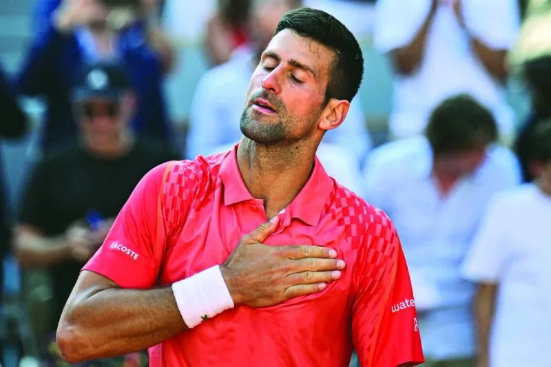 Serbia’s Novak Djokovic celebrates his victory over Russia’s Karen Khachanov in the French Open quarter-final in Paris on Tuesday. (AFP)