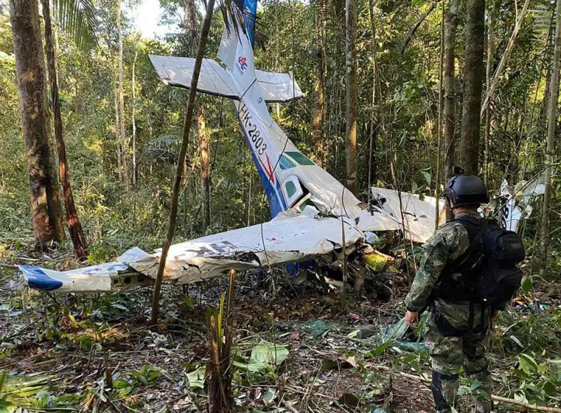 A soldier standing next to the wreckage of an aircraft that crashed in the Colombian Amazon forest in the municipality of Solano, department of Caqueta, on May 19, 2023. AFP PHOTO / COLOMBIAN ARMY