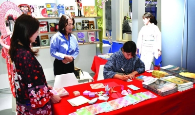 Book fair visitors can enjoy calligraphy demonstrations and have their names written in Japanese characters at the Japanese embassy booth. PICTURE: Thajudheen