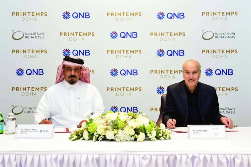 QNB Group Retail Banking senior executive vice-president Adel Ali al-Malki with Doha Oasis chairman Victor Agha.
