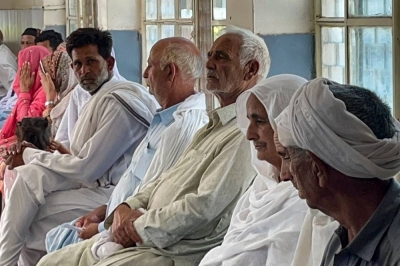 Relatives of migrants, who went missing after an overloaded trawler capsized and sank in the Ionian Sea, wait to provide DNA samples at a hospital in Bandli village, in Pakistan-administered Kashmir on June 20. Sajjad QAYYUM / AFP