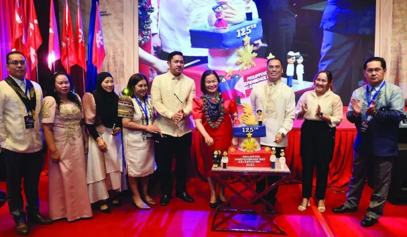 Philippine ambassador Lillibeth V Pono (fourth right) joins a cake cutting ceremony on the occasion. PICTURE: Shaji Kayamkulam.