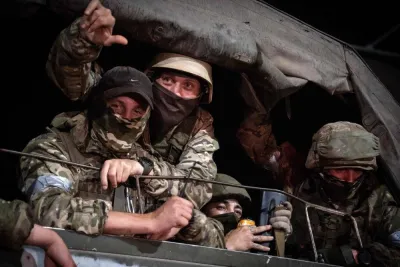 Members of Wagner group looks from a military vehicle in Rostov-on-Don late on June 24. Roman ROMOKHOV / AFP