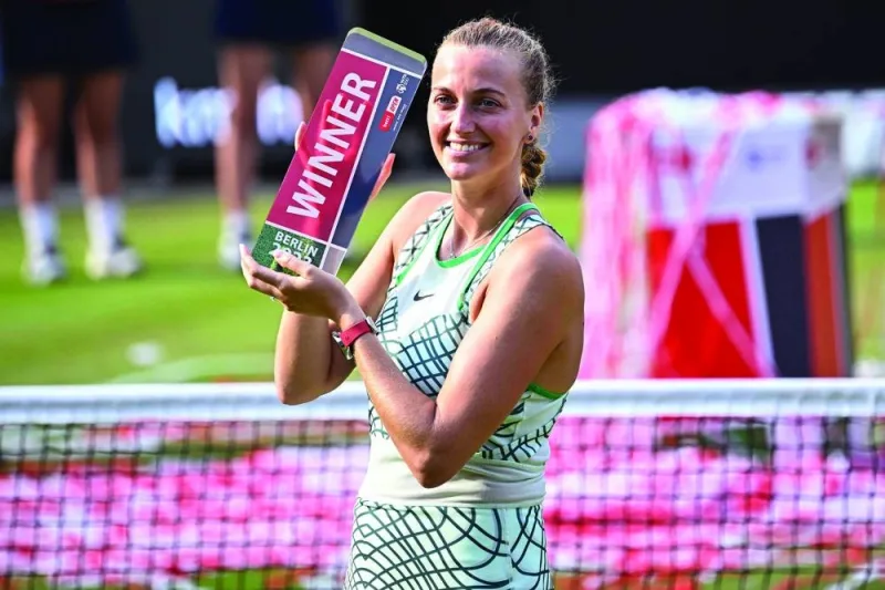 Czech Republic’s Petra Kvitova celebrates with the trophy after winning against Croatia’s Donna Vekic in the singles final of the WTA German Open in Berlin on Sunday. (AFP)