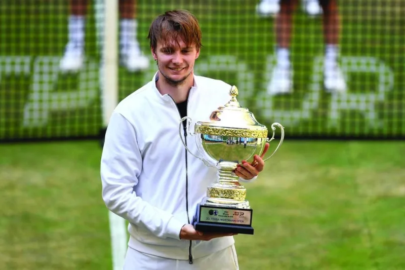 Kazakhstan&#039;s Alexander Bublik poses with his trophy after winning the singles final of the ATP 500 Halle Open, western Germany, on Sunday. (AFP)
