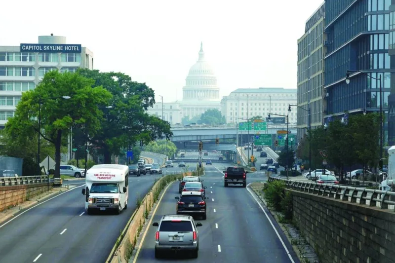
Cars drive in hazy smoke on South Capitol Street towards the US Capitol Building on Thursday in Washington, DC. 