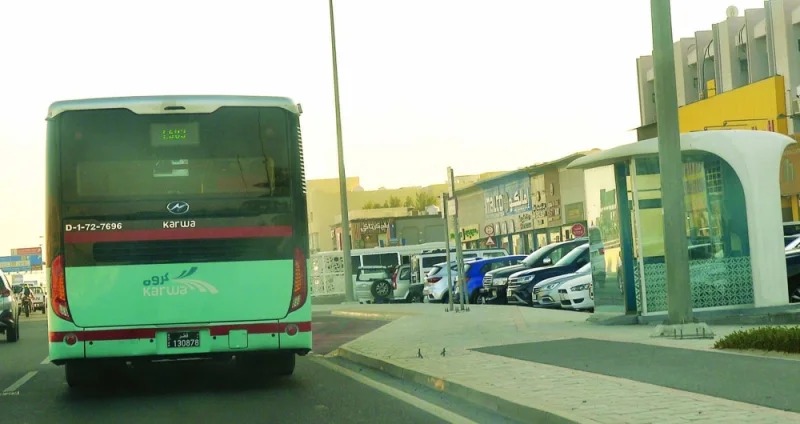 A public transport bus drives past an air-conditioned bus shelter in Doha. PICTURE: Shaji Kayamkulam.
