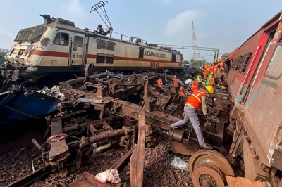 Rescue workers sift through wreckage at the accident site of a three-train collision near Balasore on June 3, 2023. Indian police said on July 7 they had arrested three men over a triple-train collision that killed nearly 300 people last month, one of the worst rail accidents in the country&#039;s history. File picture: Dibyangshu SARKAR / AFP