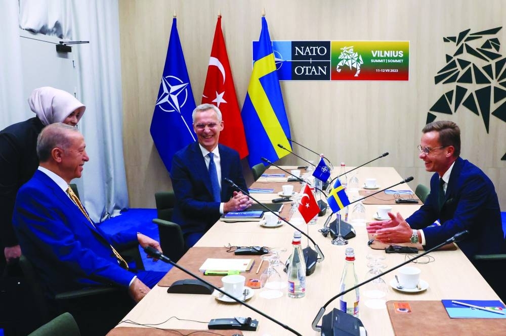 
Nato Secretary-General Jens Stoltenberg (top-C), Turkish President Tayyip Erdogan (left) and Swedish Prime 
Minister Ulf Kristersson react during a meeting, on the eve of a Nato summit, in Vilnius yesterday. (AFP) 