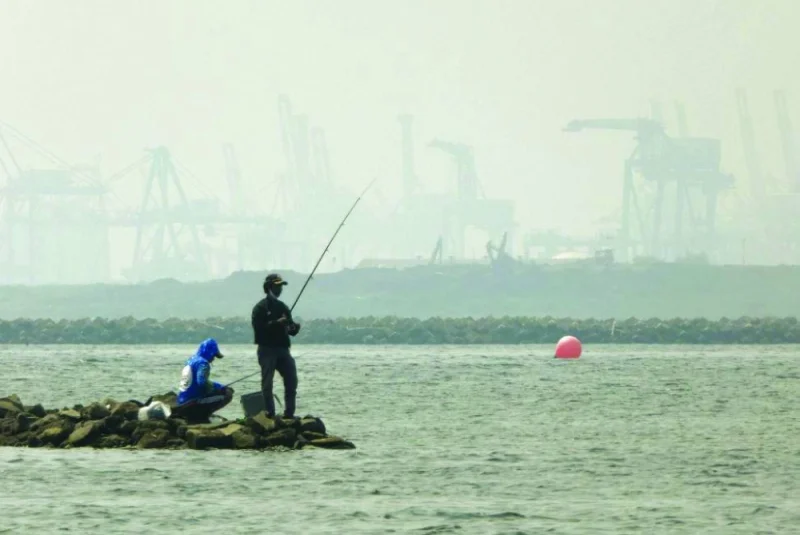
Anglers fish amid thick haze at a coastal area in Jakarta. (AFP) 