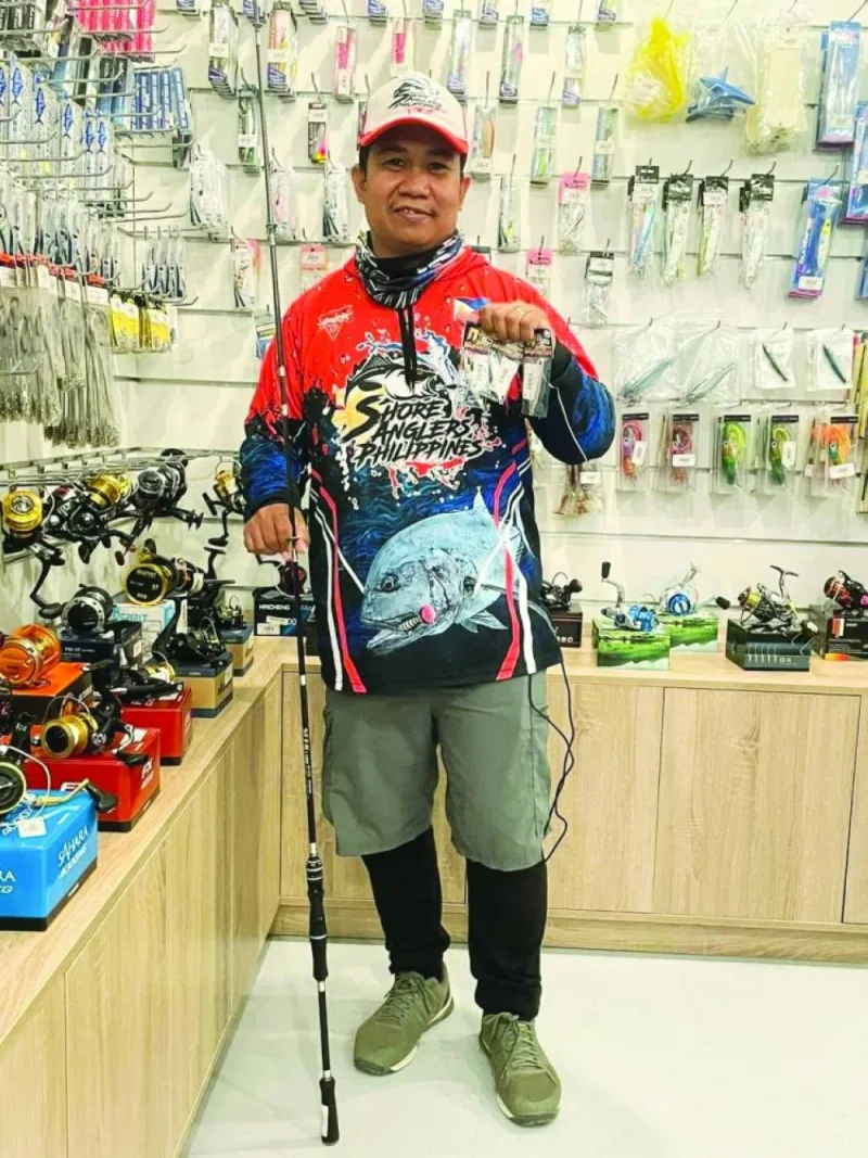 Adrian “Migs” Alfaras scouts for fishing accessories.