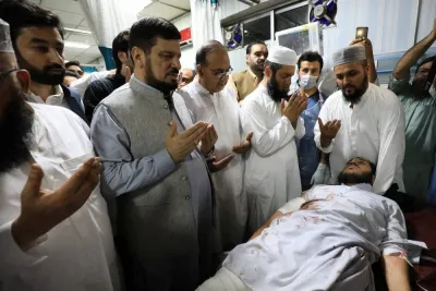 Governor of Khyber Pakhtunkhwa province, Haji Ghulam Ali, prays along with people while visiting a man, who was injured, after a blast in Bajaur district of Khyber Pakhtunkhwa, at the Lady Reading Hospital in Peshawar, Pakistan July 30. REUTERS