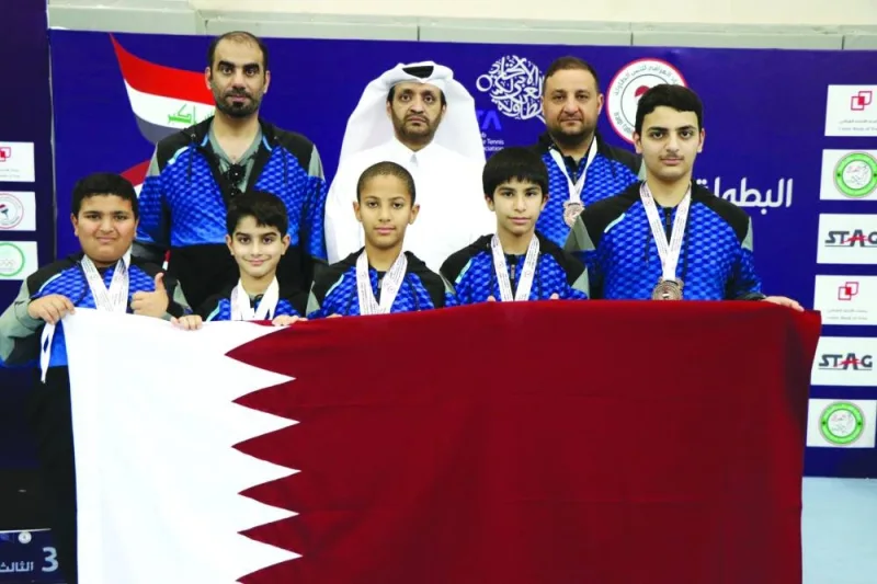 
Qatar table tennis players seen with Qatar Table Tennis Association official (QTTA) after winning a medal at the Arab Championship in Iraq. 