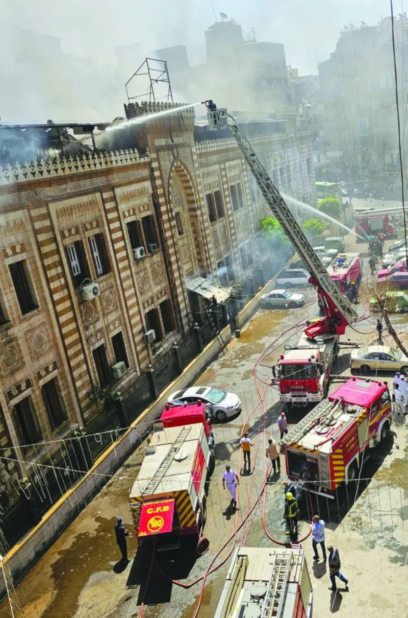 
Egyptian firefighters extinguish a fire that broke out in the historic neo-Islamic ministry in central Cairo.  