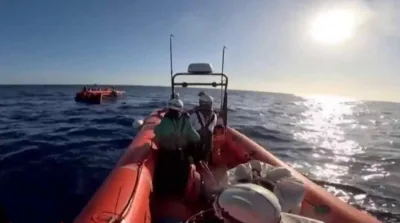 A screengrab from a video posted on social media that shows the rescue efforts after the shipwreck.