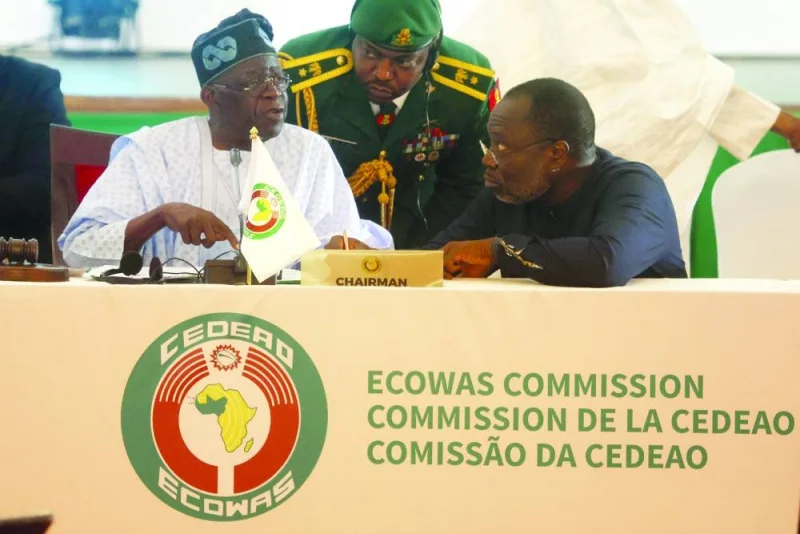 
Chairperson of Economic Community of West African States (ECOWAS) and President of Nigeria, Bola Ahmed Tinubu (left) interacts with President of ECOWAS Commission Omar Touray, during the meeting in Abuja. 