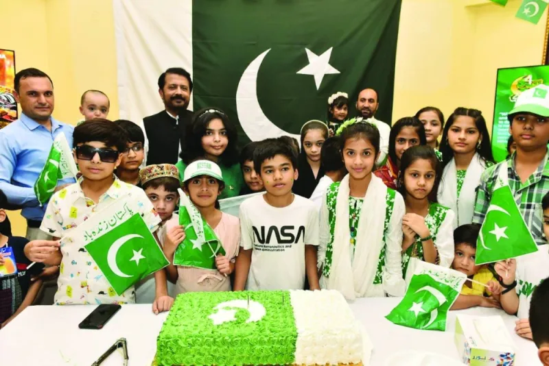 The ambassador joins children for the cake cutting