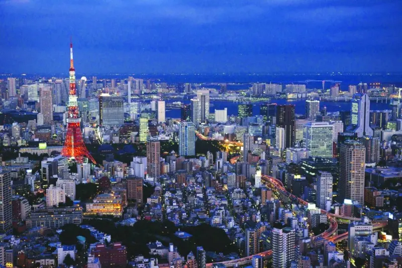 
The Tokyo Tower, left, and commercial and residential buildings stand at dusk in Minato district of Tokyo. Blackstone is exploring more acquisitions in Japanese real estate, after selling about $4.5bn worth in the past year to capitalise on high international interest in property in the island nation. 