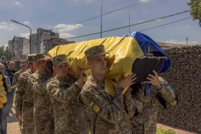 Ukrainian servicemen carry the coffin of Andrii Veremiienko, who was killed fighting Russian troops in the Donetsk region, during a funeral ceremony in Kyiv on August 17, amid the Russian invasion of Ukraine. AFP
