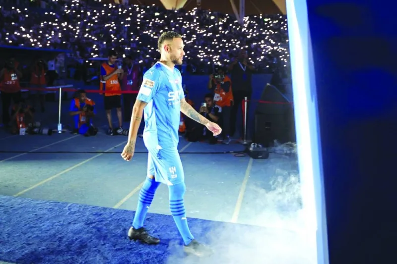 Neymar enters the pitch during his unveiling ceremony at Al Hilal in Riyadh on Saturday. (AFP)
