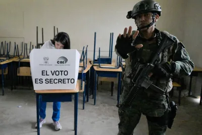 
Left: Presidential candidate Luisa Gonzalez votes under heavy security at a polling station in Canuto, Manabi province. 