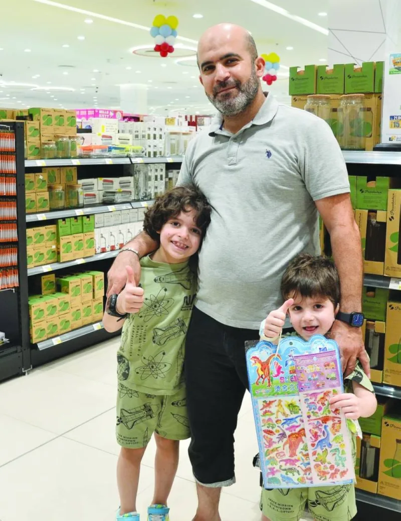 Omar, a Doha resident, with his two children at Al Rawnaq, LuLu Ain Khaled branch Friday. PICTURES: Shaji Kayamkulam.