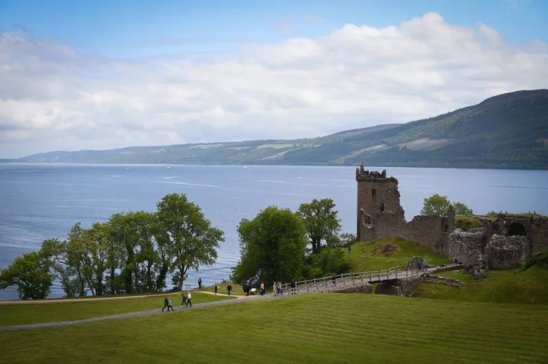 Tourists visit Urquhart Castle on the banks of Loch Ness in the Scottish Highlands on June 10, 2018. AFP