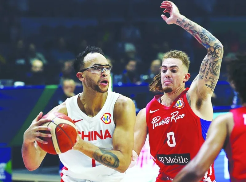 Puerto Rico’s Isaiah Pineiro and China’s Kaier Li in action during their FIBA World Cup Group B match at Araneta Coliseum, Quezon, Philippines, on Wednesday. (Reuters)