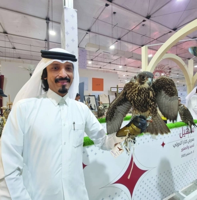 Farhan al-Sayed with a falcon at the seventh edition of Katara International Falcon and Hunting Exhibition. PICTURE: Joey Aguilar