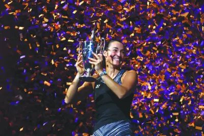 Caroline Garcia of France celebrates with the Billie Jean King Trophy after defeating Aryna Sabalenka of Belarus in their Singles Final 
during the WTA Finals, part of the Hologic WTA Tour, at Dickies Arena on November 7, 2022 in Fort Worth, Texas. (AFP)