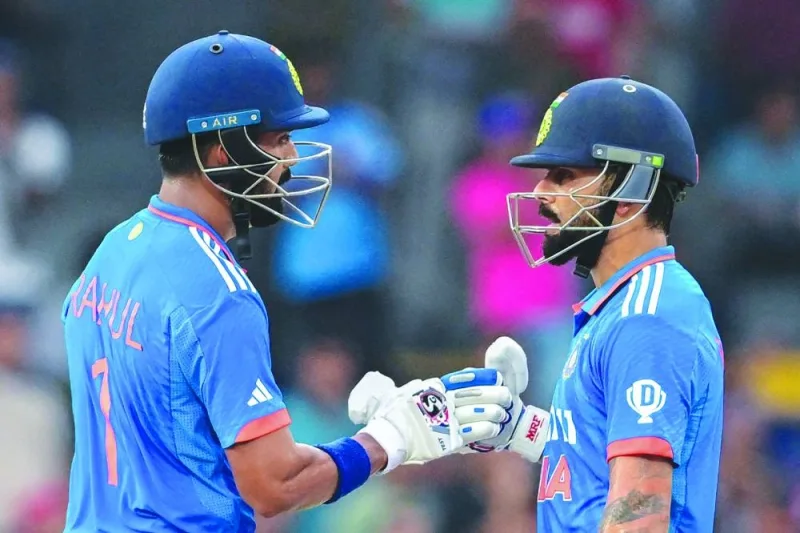 
India’s Virat Kohli (right) and K L Rahul bump their fists during the Asia Cup 2023 Super Four one-day 
international in Colombo yesterday. (AFP) 