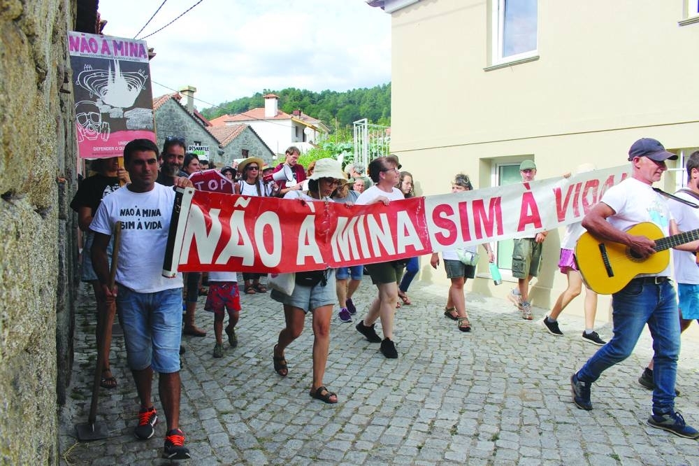 
People carrying a banner saying “No to the mine. Yes to life” take part in a anti-lithium protest in Covas do Barroso, Portugal, last month. (Reuters) 