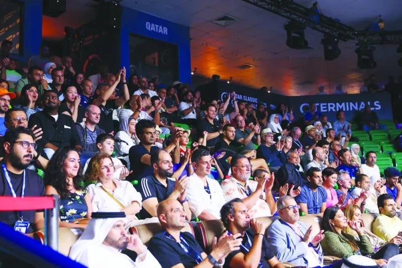 Fans watch the QTerminals Qatar Classic final between Hania El Hammamy of Egypt and compatriot Nour El Sherbini at the Khalifa Tennis and Squash Complex in Doha on Friday. 