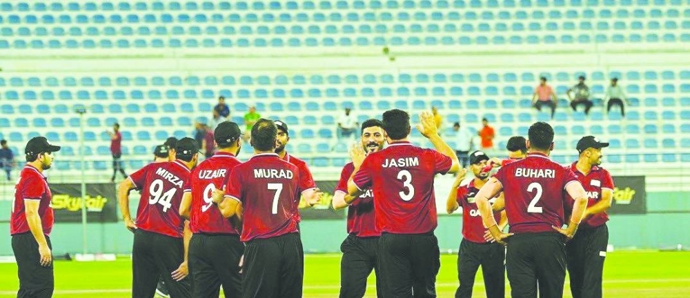 
Qatar players celebrate a dismissal during their Gulf T20I match against Kuwait in Doha yesterday. Qatar won the match by 1 run. 